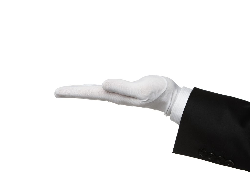 Picture of hand held out with white glove, depicting white glove service